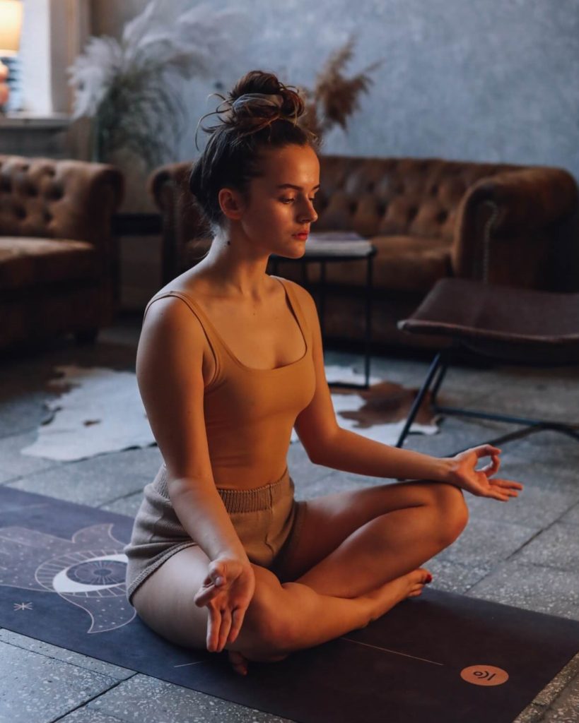 woman listening to zen music and meditating