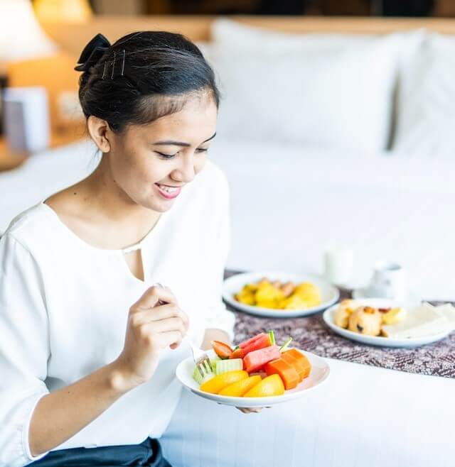 woman eating fruit