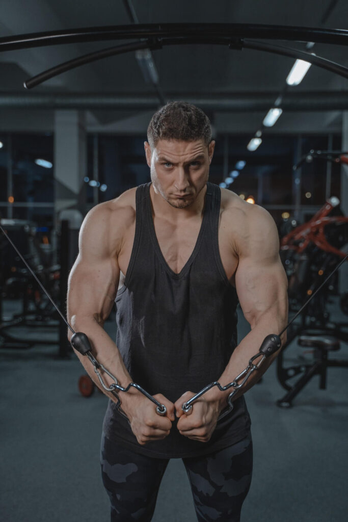 man working out his arms in the gym