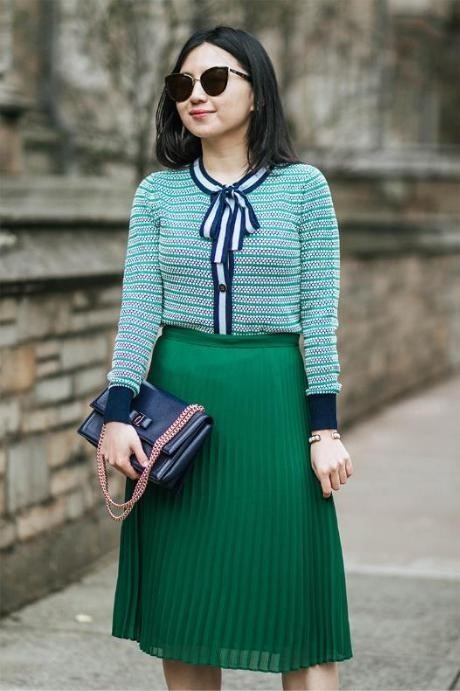 wearing cardigan and pleated skirt