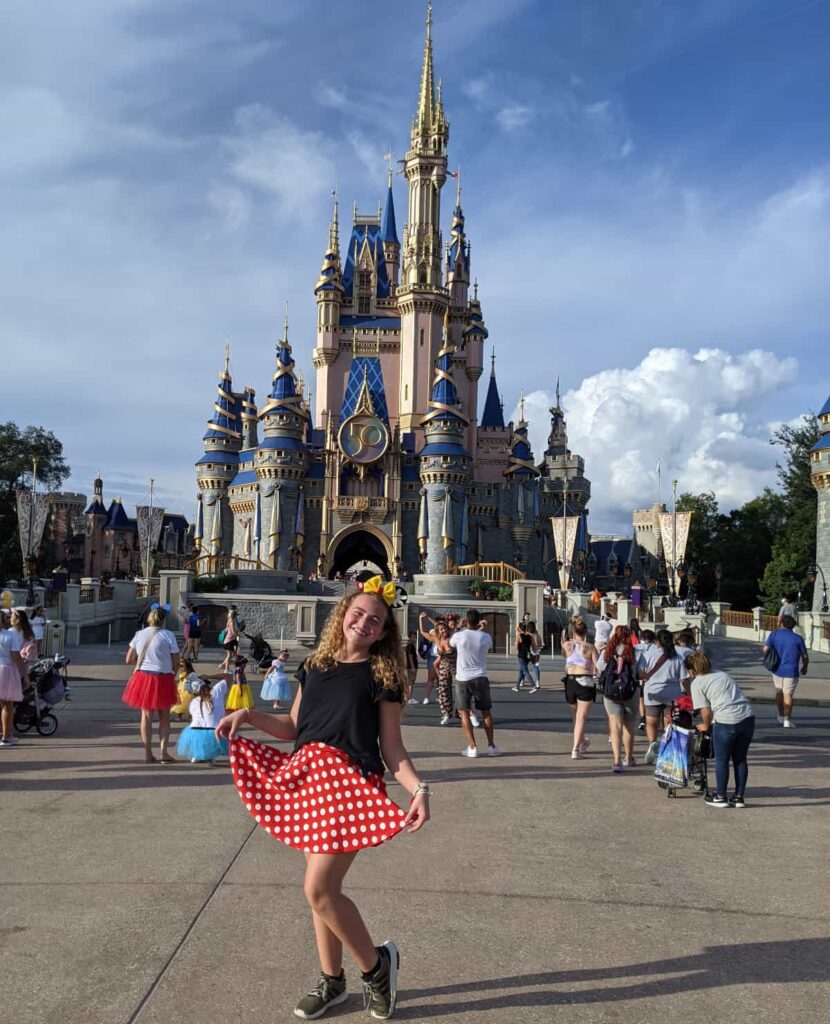 little girl in a red skirt with polka dots