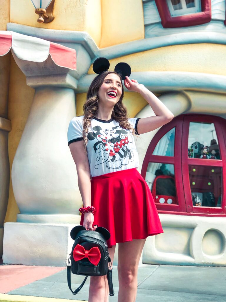summer Disney world outfit ideas, mickey mouse shirt, and a short red skirt