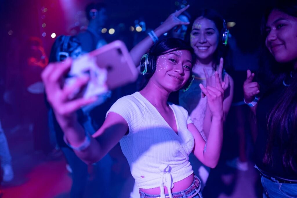 girls taking a selfie at a concert