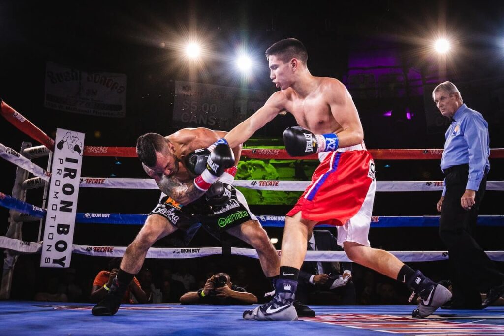 two guys boxing in a arena